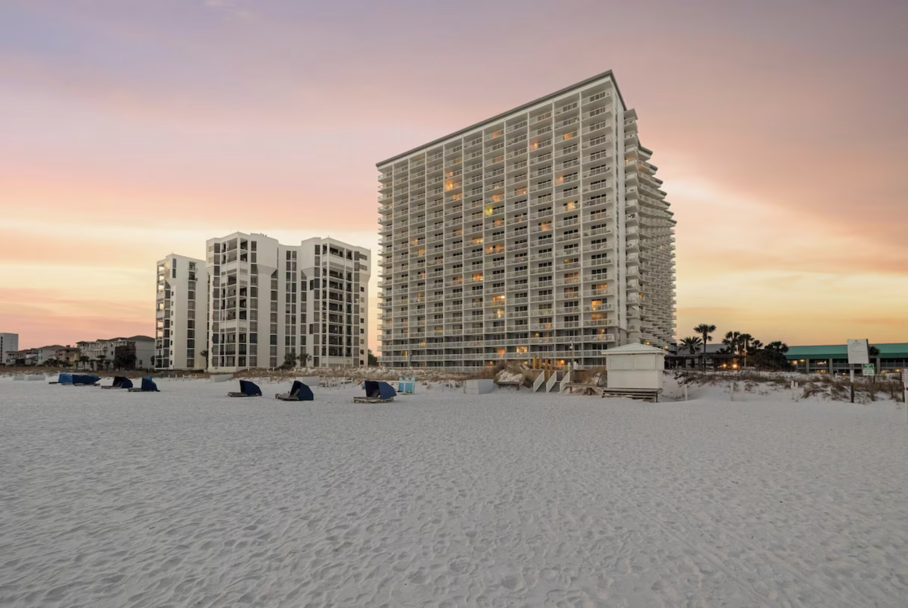 Pelican Beach Resort building in soft sunset light